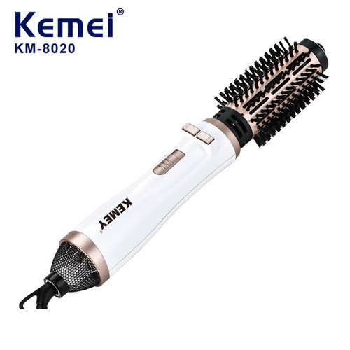 سشوار برسدار چندکاره KEMEY مدل Hot Air Styler با توان ۱۲۰۰ وات و پوشش سرامیکی، مناسب برای خشککردن، فر کردن و حجمدهی مو، طراحی شده با برس گرد و دسته ارگونومیک سفید نقرهای.